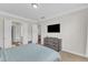 Spacious bedroom featuring a comfortable bed, dresser and plenty of natural light at 1808 Pennypacker Ln, Durham, NC 27703