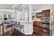 Kitchen with breakfast bar seating, pendant lighting, and access to the dining area at 1808 Pennypacker Ln, Durham, NC 27703