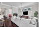 Spacious living room with fireplace and comfortable gray sectional sofa at 1808 Pennypacker Ln, Durham, NC 27703