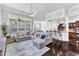 Open-concept living room features a large sectional sofa, kitchen access, and recessed lighting at 1808 Pennypacker Ln, Durham, NC 27703