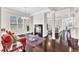 Open living room with a fireplace, hardwood floors, and natural light, perfect for gatherings at 1808 Pennypacker Ln, Durham, NC 27703