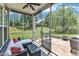 Relaxing screened porch with comfortable seating and views of the lush backyard and landscaping at 1808 Pennypacker Ln, Durham, NC 27703