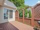 Spacious back deck featuring a wood trellis and ample room for grilling and outdoor enjoyment at 1817 Wysong Ct, Raleigh, NC 27612