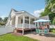 Backyard patio with covered deck, perfect for enjoying outdoor meals and gatherings at 1817 Wysong Ct, Raleigh, NC 27612
