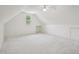 Large bonus room with neutral carpet, a ceiling fan, and a bright window at 1817 Wysong Ct, Raleigh, NC 27612