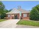 Charming community clubhouse with a reserved parking spot and well-maintained landscaping at 1817 Wysong Ct, Raleigh, NC 27612