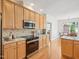 This bright kitchen features stainless steel appliances, granite counters, and an eat-in area at 1817 Wysong Ct, Raleigh, NC 27612