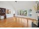 Bright living room featuring a large window, hardwood floors, and white walls at 1817 Wysong Ct, Raleigh, NC 27612