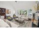 Bright living room featuring a large window, hardwood floors, and fireplace at 1817 Wysong Ct, Raleigh, NC 27612