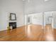 Spacious living room with hardwood floors, fireplace, and tall ceilings at 1817 Wysong Ct, Raleigh, NC 27612