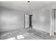 Bedroom with carpet flooring and an adjoining door, ready for personalization at 1818 Cecil St, Durham, NC 27707
