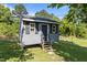 A detached structure with steps and a neutral color palette at 1818 Cecil St, Durham, NC 27707
