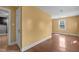 Spacious living area with hardwood floors and view of entryway, bathed in natural light at 1818 Cecil St, Durham, NC 27707