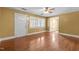 Open living room with hardwood floors, natural light, and a view of the entryway at 1818 Cecil St, Durham, NC 27707