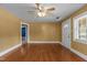 Bright living room with hardwood floors, ceiling fan, and ample natural light at 1818 Cecil St, Durham, NC 27707