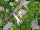 Birds eye view of home with detached garage, green space, and concrete driveway at 2100 Summit St, Durham, NC 27707