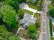 Aerial view of the house and surrounding lot showcasing a new driveway and fenced backyard at 2100 Summit St, Durham, NC 27707