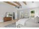 Bright bedroom featuring wooden beams, stylish decor, and natural light from nearby windows at 2100 Summit St, Durham, NC 27707