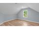 Cozy bedroom with natural light, hardwood floors, and neutral paint at 2100 Summit St, Durham, NC 27707