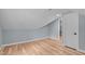 Well-lit bedroom with sloped ceiling, hardwood floors, and neutral paint at 2100 Summit St, Durham, NC 27707