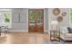 Entryway featuring hardwood floors, double doors with glass panels, and stylish decor at 2100 Summit St, Durham, NC 27707