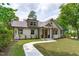 Charming home with white brick, covered porch, and a well-manicured front yard at 2100 Summit St, Durham, NC 27707