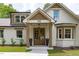 Beautiful home with manicured lawn, front porch and wood accents at 2100 Summit St, Durham, NC 27707