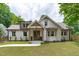 A beautiful home featuring a stylish front exterior with a well-maintained lawn and landscaped garden at 2100 Summit St, Durham, NC 27707