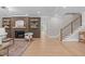 Inviting living room featuring a modern fireplace, built-in shelves, and hardwood floors at 2100 Summit St, Durham, NC 27707
