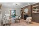 Cozy living room featuring modern fireplace, built-in shelves, and stylish furnishings at 2100 Summit St, Durham, NC 27707
