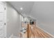 Bright loft space features hardwood floors, an office space, and a view to the living room below at 2100 Summit St, Durham, NC 27707
