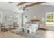 Spacious main bedroom with vaulted ceilings, a chandelier, and serene natural light from surrounding windows at 2100 Summit St, Durham, NC 27707
