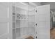 Walk-in pantry with custom shelving, wine rack, and ample storage space at 2100 Summit St, Durham, NC 27707