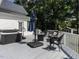 Relaxing back deck with hot tub, patio umbrella, and wicker furniture, perfect for outdoor enjoyment at 212 W Church St, Benson, NC 27504