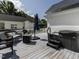 Spacious back deck featuring wicker furniture, a hot tub, and an umbrella, great for relaxing at 212 W Church St, Benson, NC 27504