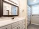 Bright bathroom featuring a vanity sink with white cabinetry at 212 W Church St, Benson, NC 27504