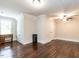 Bright bedroom with a window, closet, hardwood floors, and a ceiling fan at 212 W Church St, Benson, NC 27504