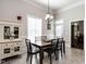 Dining room with wood table, bright window, and built in cabinet at 212 W Church St, Benson, NC 27504