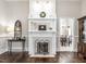 Living room fireplace with white mantel, decorative tile, and black metal screen at 212 W Church St, Benson, NC 27504