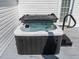 Close-up view of a modern hot tub on a wooden deck, offering relaxation and entertainment at 212 W Church St, Benson, NC 27504