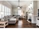 Inviting living room features a decorative fireplace, crown molding and hardwood floors at 212 W Church St, Benson, NC 27504