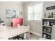 Home office featuring a desk, bookcase, decor, and window at 212 W Church St, Benson, NC 27504