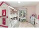 Pink room with bunk bed, vanity, cloud rug, and a window letting in natural light at 216 Captain Harbor Hbr, Sanford, NC 27332