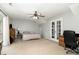 Large bedroom with ceiling fan and vaulted ceilings plus a door to a walk-in closet at 216 Captain Harbor Hbr, Sanford, NC 27332