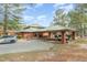 Community center exterior showcasing covered parking and attractive landscaping at 216 Captain Harbor Hbr, Sanford, NC 27332