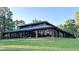 Exterior view of the community center, highlighting its large windows and well-maintained grounds at 216 Captain Harbor Hbr, Sanford, NC 27332
