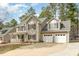 Charming two-story home featuring a covered front porch and a two-car garage at 216 Captain Harbor Hbr, Sanford, NC 27332