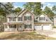Charming two-story home featuring a covered front porch and a two-car garage at 216 Captain Harbor Hbr, Sanford, NC 27332