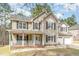 Charming two-story home featuring a covered front porch and a two-car garage at 216 Captain Harbor Hbr, Sanford, NC 27332