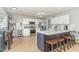 Well-equipped kitchen with white cabinets, granite countertops, and a functional island at 216 Captain Harbor Hbr, Sanford, NC 27332